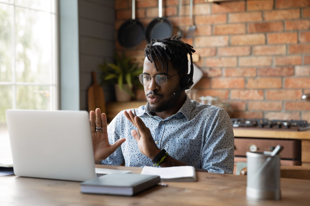 Man on conference call on laptop