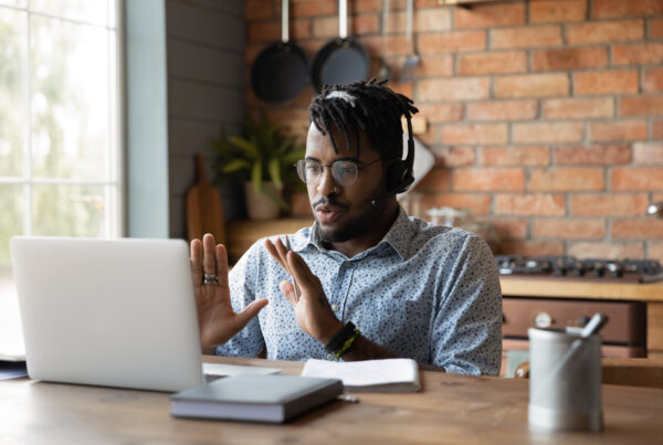 Man on conference call on laptop